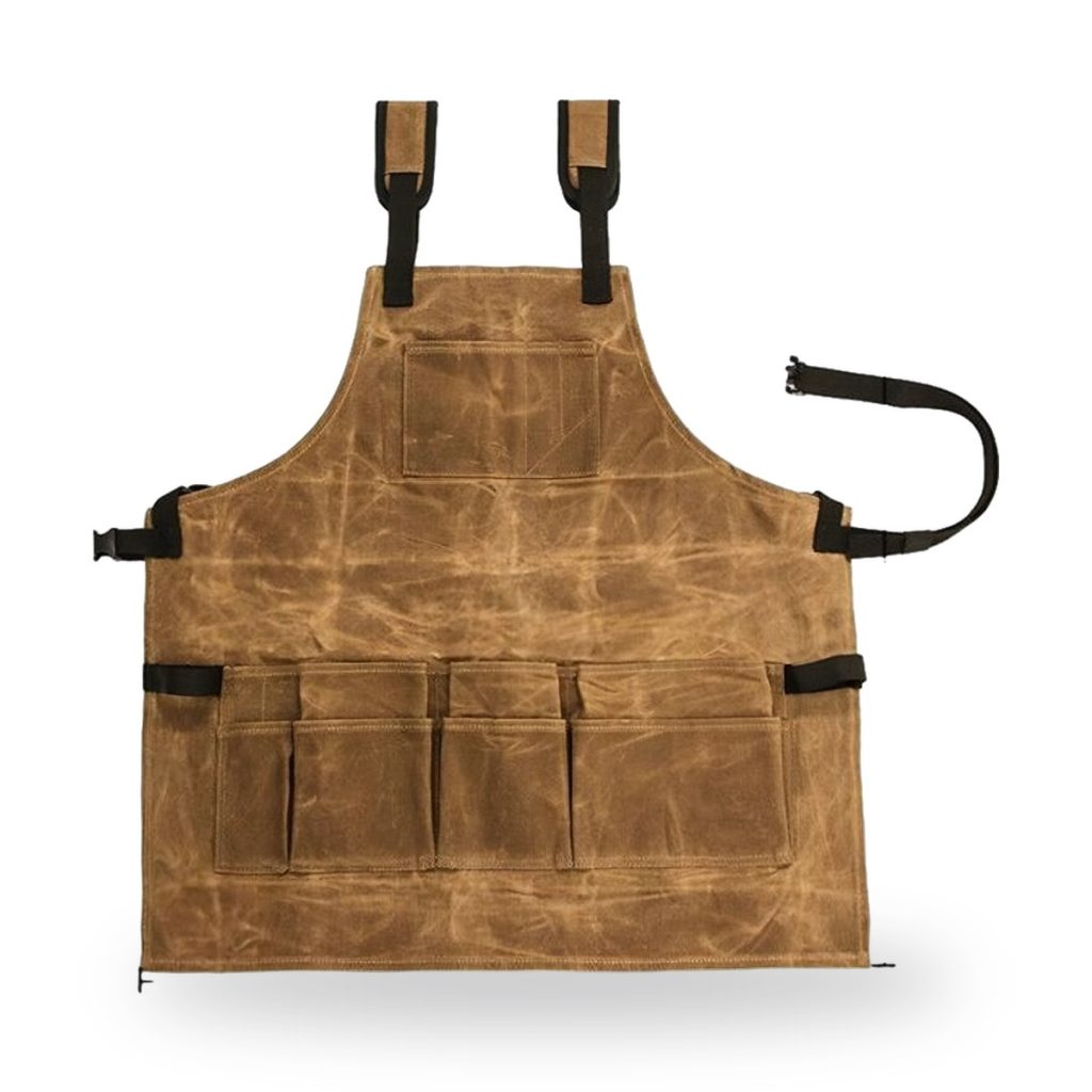 Brown waxed canvas apron with multiple pockets and adjustable straps.