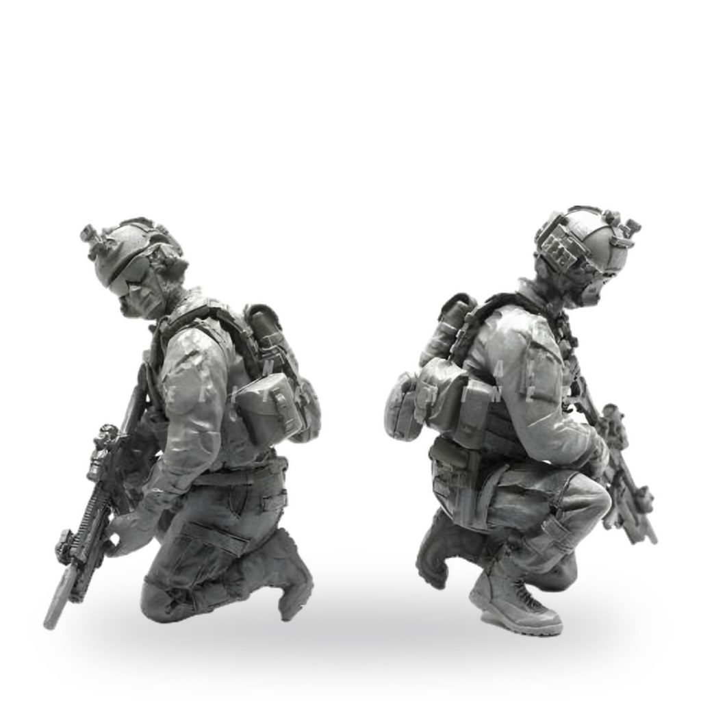 Unpainted US Army soldier in combat gear holding rifle.