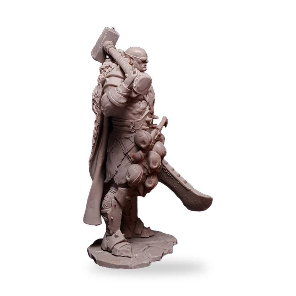 Unpainted Warbringer Warrior fantasy warlord figure with axe and shield.