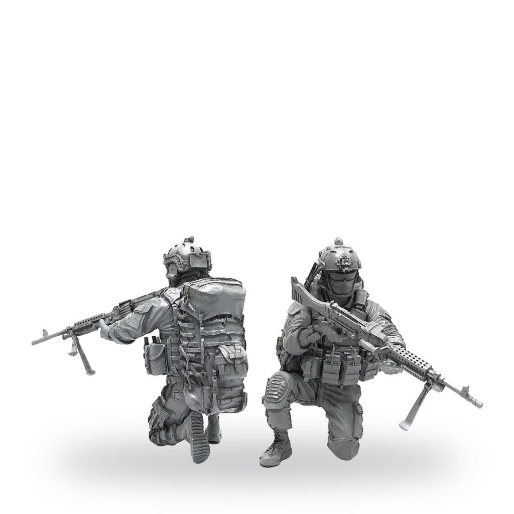 Unpainted US Special Forces soldier figures in tactical gear with rifles.