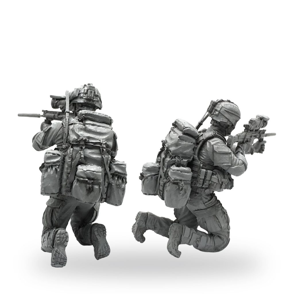 Unpainted US Navy SEAL soldier figures in combat gear with rifles.